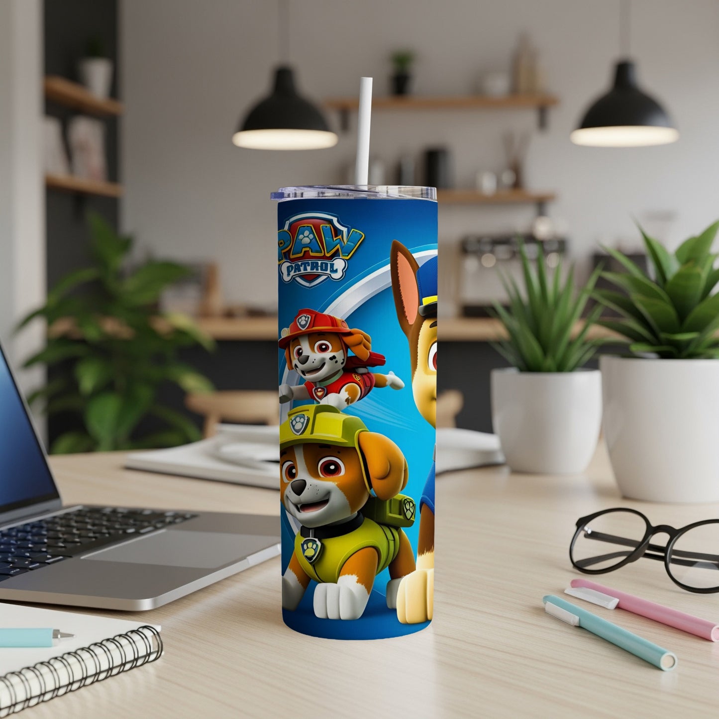 Paw Patrol characters Chase and Marshall on a blue tumbler with straw.