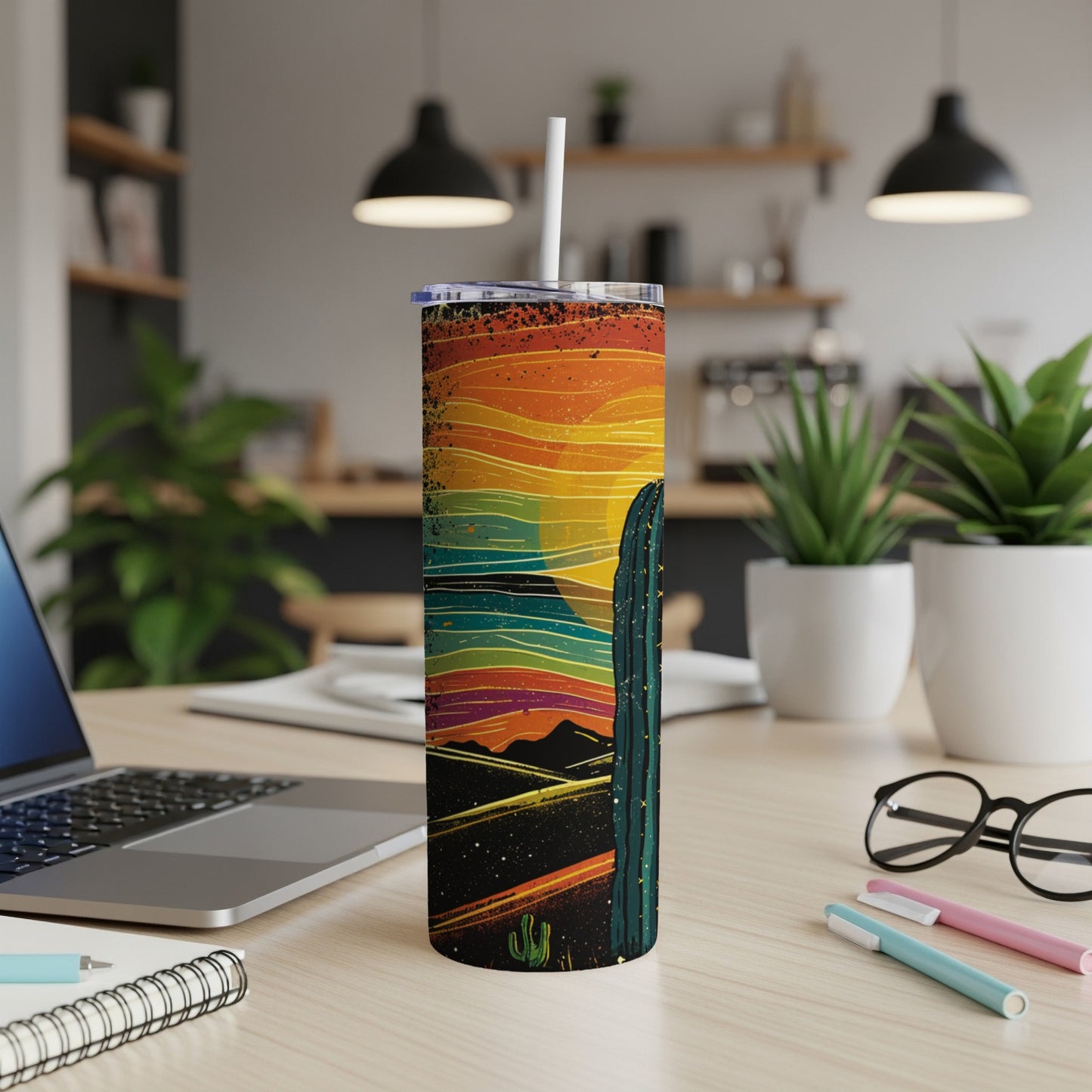 Tall tumbler with desert sunset and cactus design.