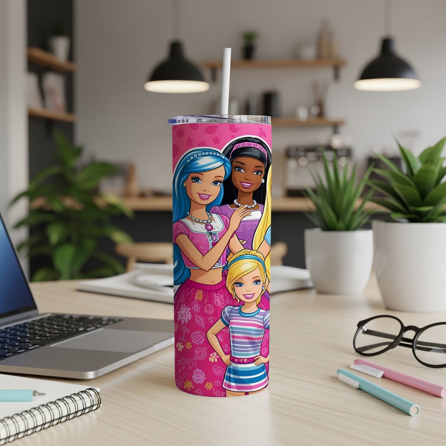 Barbie dolls in pink outfits on a skinny tumbler with a straw.