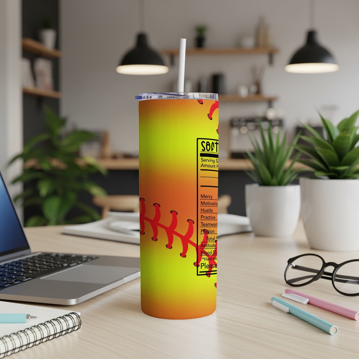 Softball nutrition facts tumbler with red stitching on a yellow-orange gradient.