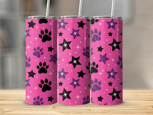 Pink tumbler with black paw prints and white stars pattern.