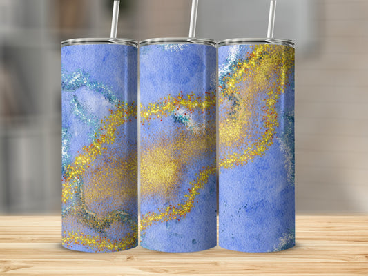 Three blue tumblers with gold glitter and marble accents.