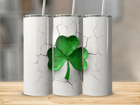 Three white tumblers with cracked surface and green shamrock design.