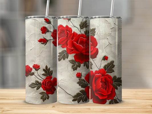 Three tumblers with red rose floral pattern on textured background.