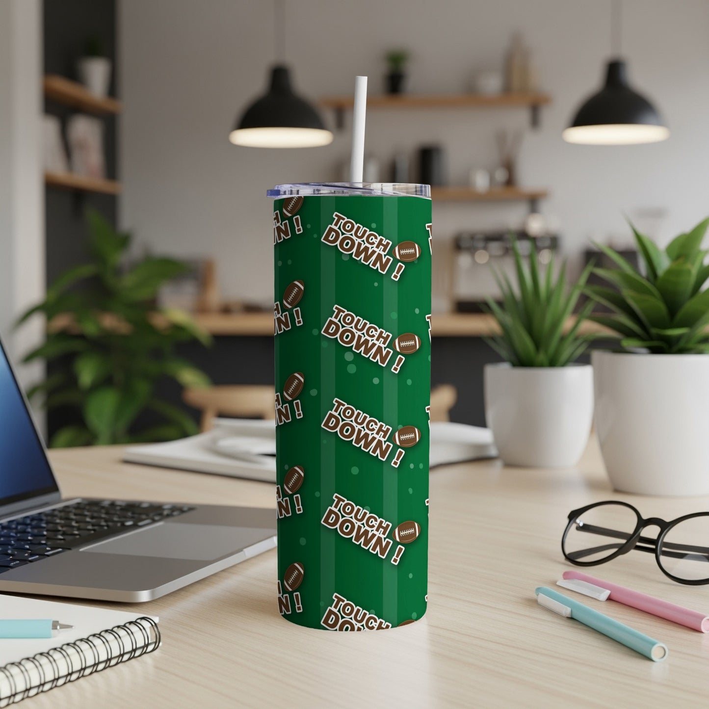 Green tumbler with repeating "Touch Down!" text and football icons against dark green vertical stripes.
