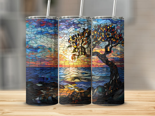 Three tumblers display a stained-glass sunset over water with a tree.