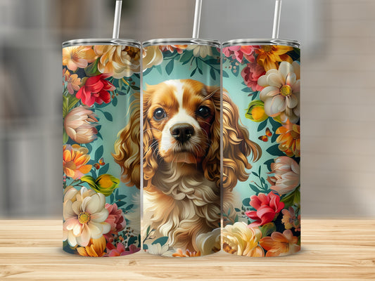 Three tumblers featuring a Cavalier King Charles Spaniel surrounded by colorful flowers.