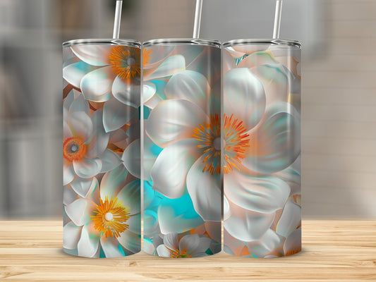 Three tumblers with a white and orange floral design on a wooden surface.