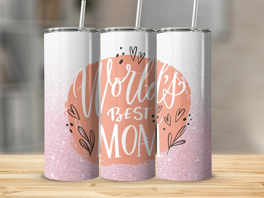 White tumbler with "World's Best Mom" text surrounded by hearts and leaves.