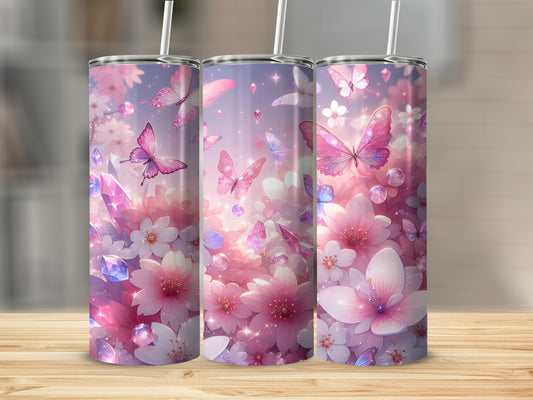 Pink floral and butterfly design on three tumblers with straws.