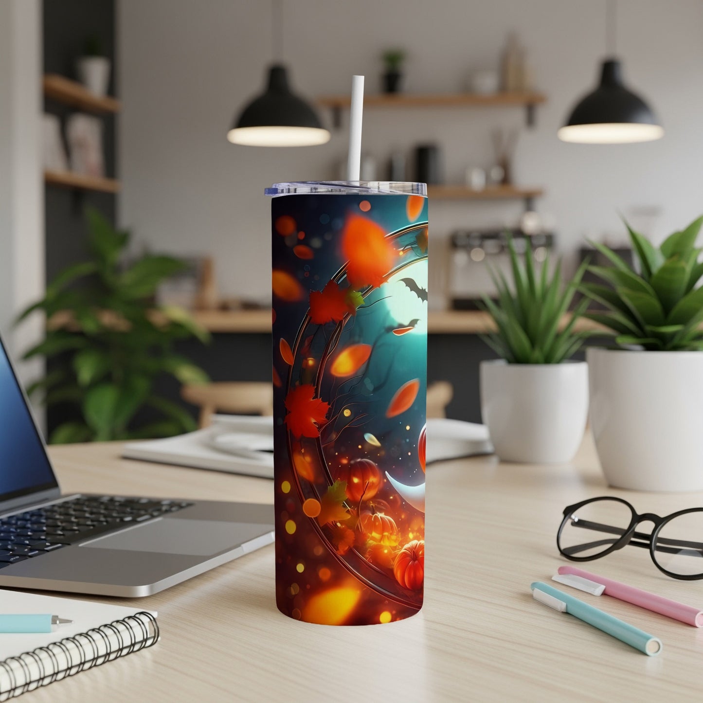 Tumbler with Halloween design: pumpkins, bats, moon, and falling leaves.