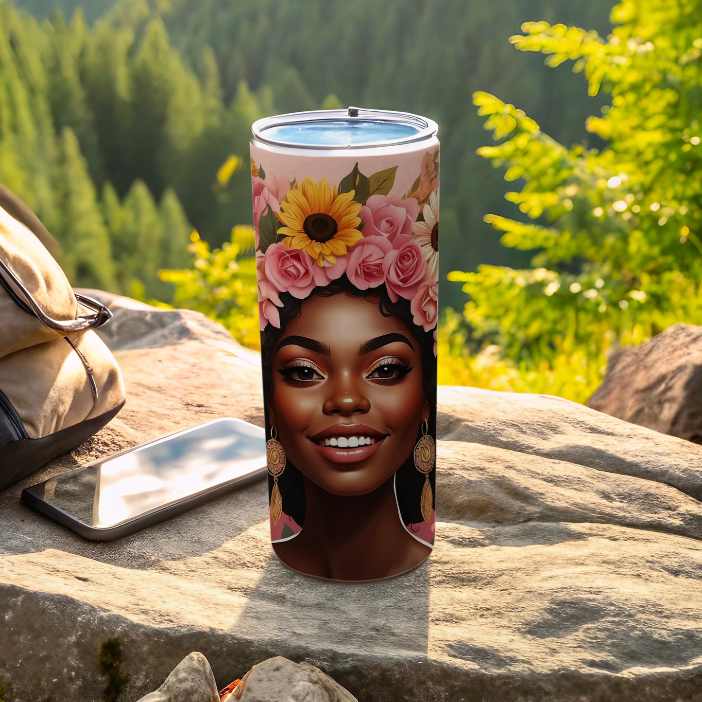 Tumbler featuring a woman's face with a floral headdress and gold earrings.