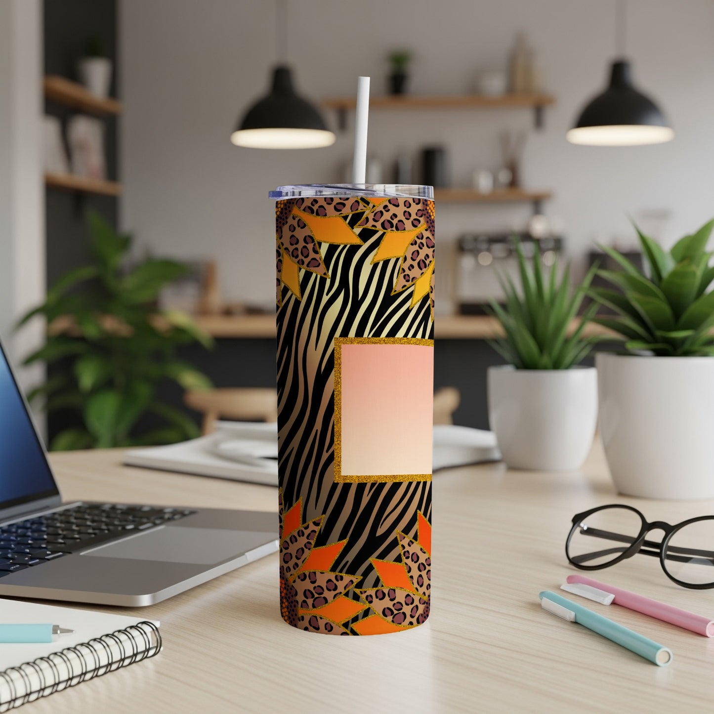Tall tumbler with zebra, leopard, and geometric print and a blank gradient square.