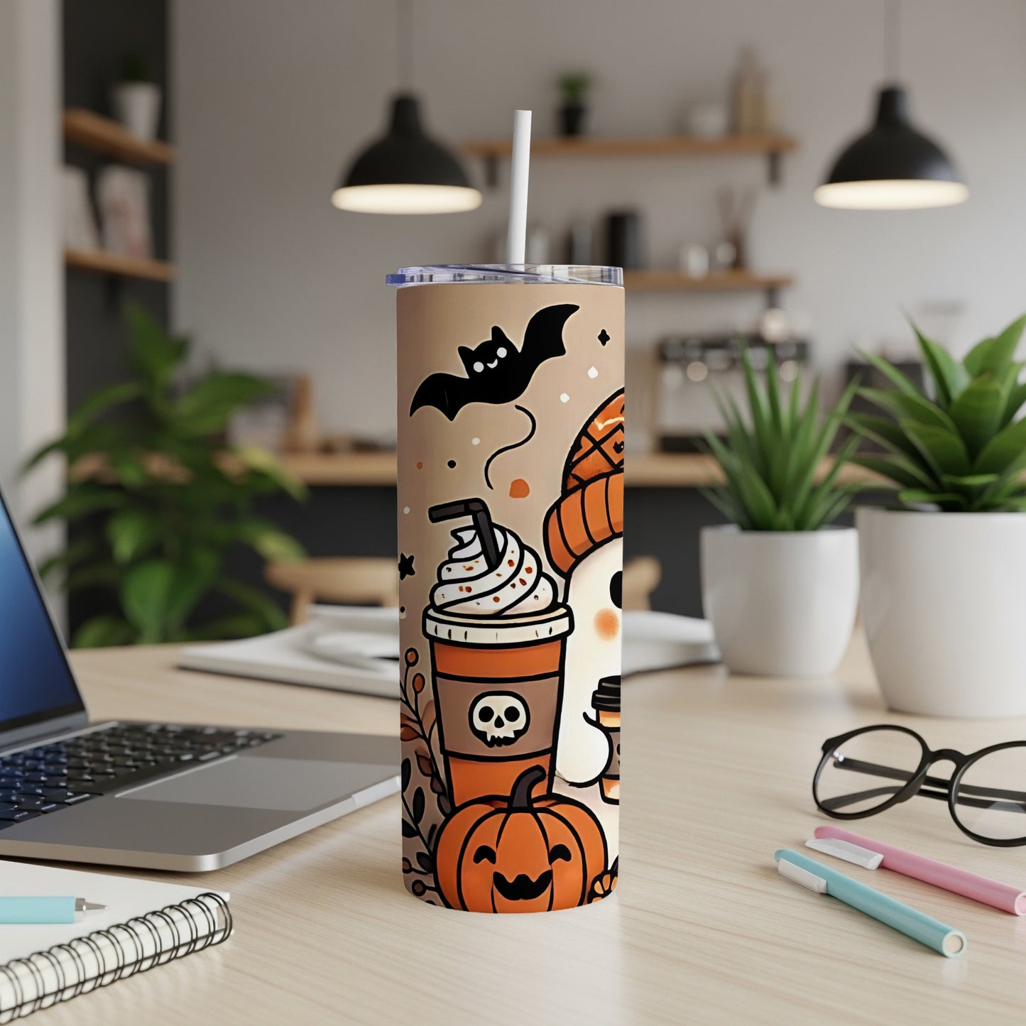 Halloween tumbler with pumpkin, ghost, and coffee cup designs.