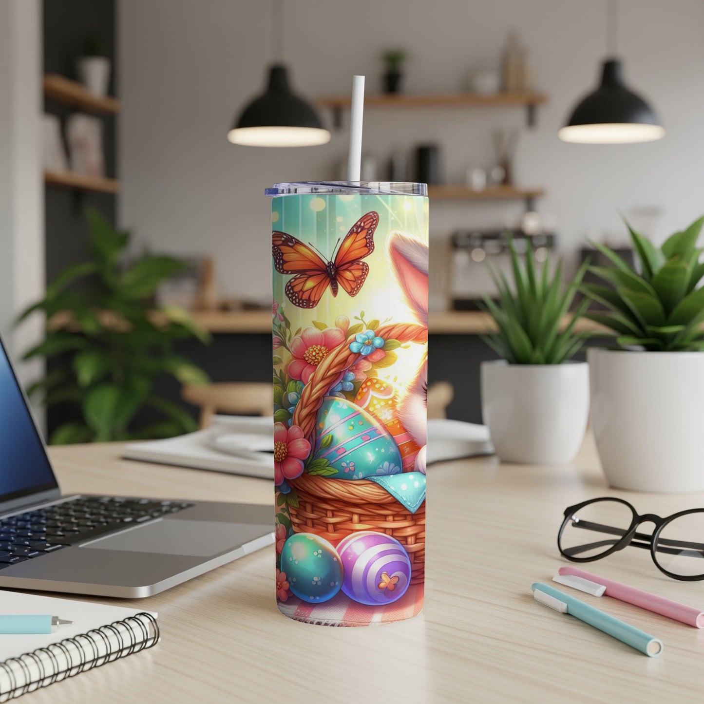 Easter tumbler with basket of eggs, flowers, and butterfly.