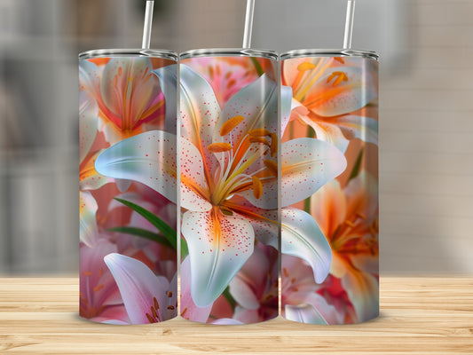 Three tumblers featuring close-up floral lily designs on a wooden surface.
