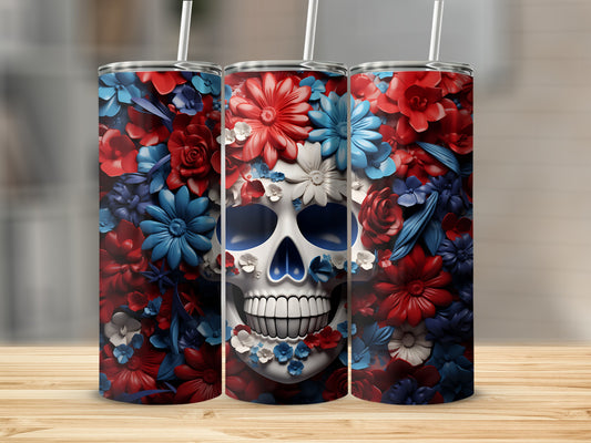 Floral skull tumbler with red, white, and blue flowers and a straw.