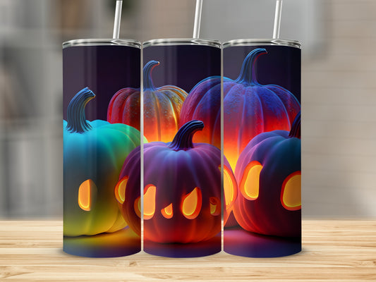 Three tumblers with colorful Halloween pumpkin designs, lit from within.