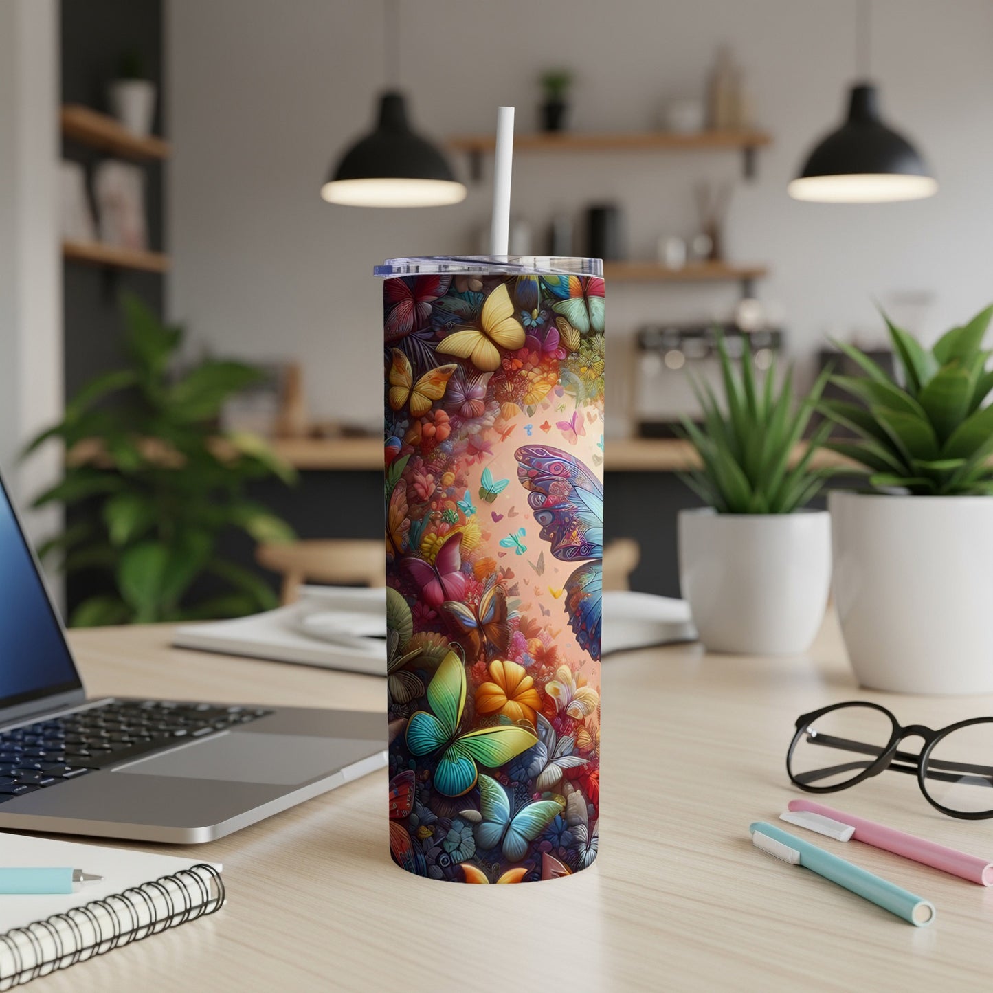 Tall tumbler adorned with colorful butterflies and floral designs.