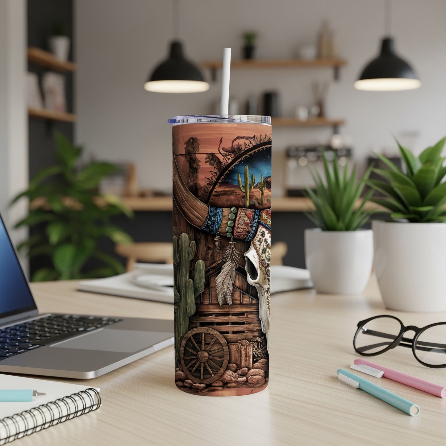 Western-themed tumbler with skull, cactus, and wagon wheel design.