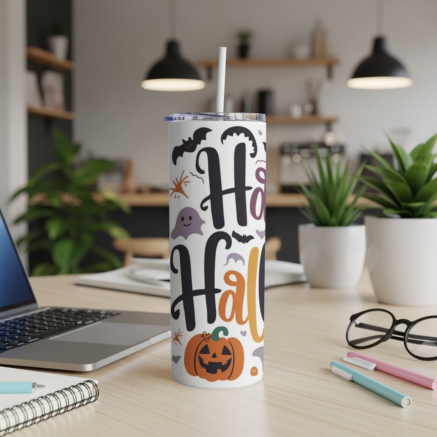 White tumbler with "Happy Halloween" text, pumpkin, ghost, and bats.