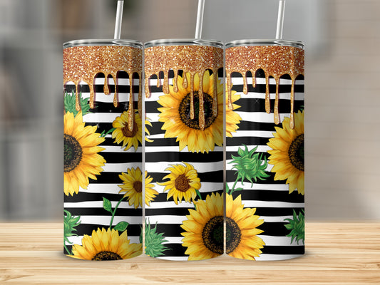 Three tumblers with sunflowers and gold glitter drips on black and white stripes.