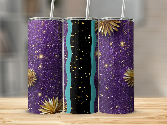 Three glitter tumblers with gold starbursts and teal accents on wood surface.