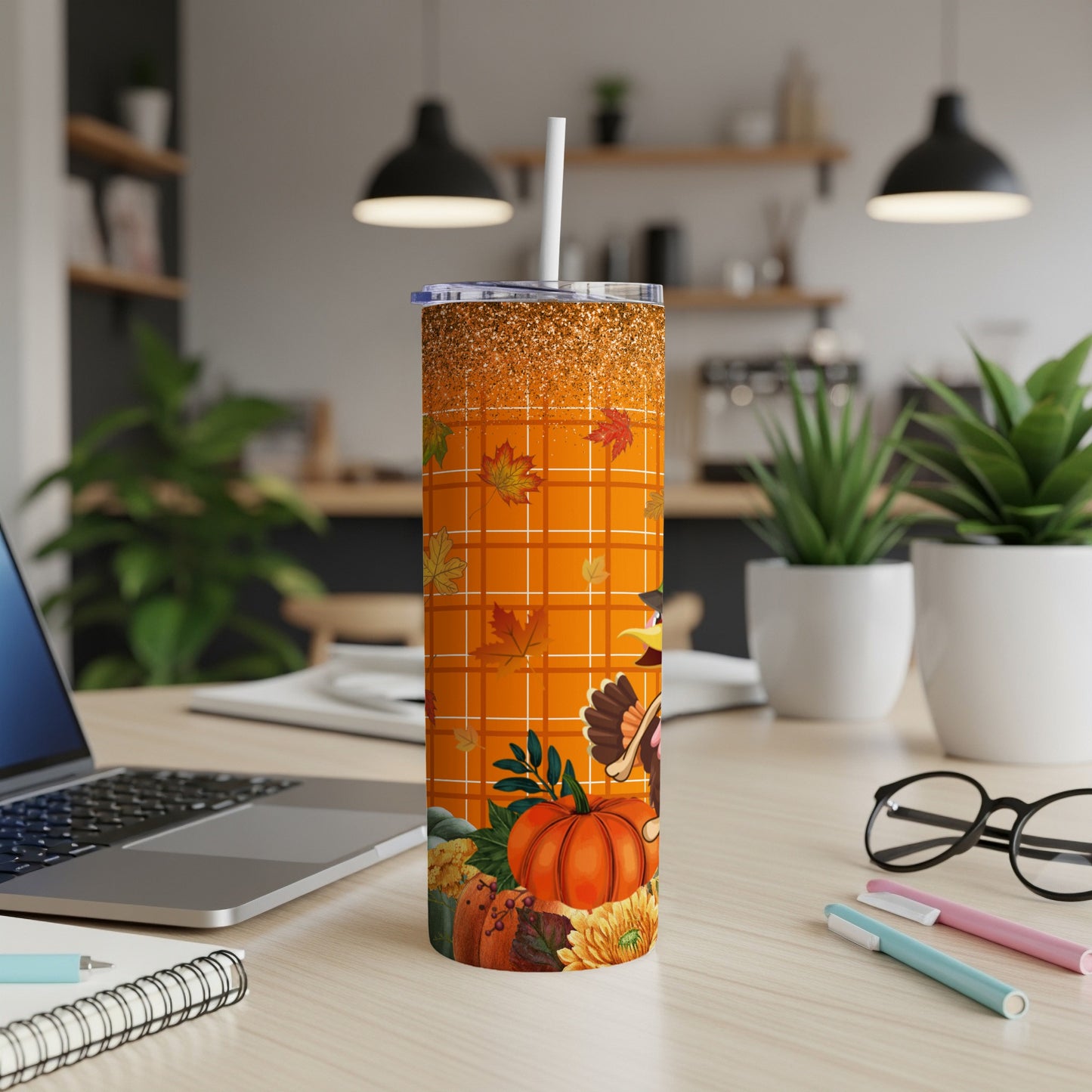 Orange Thanksgiving tumbler with turkey, pumpkin, and fall leaves design.