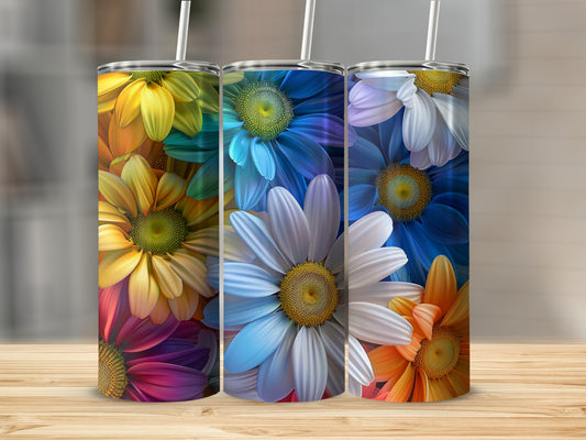 Three tumblers featuring colorful floral designs on a wooden surface.