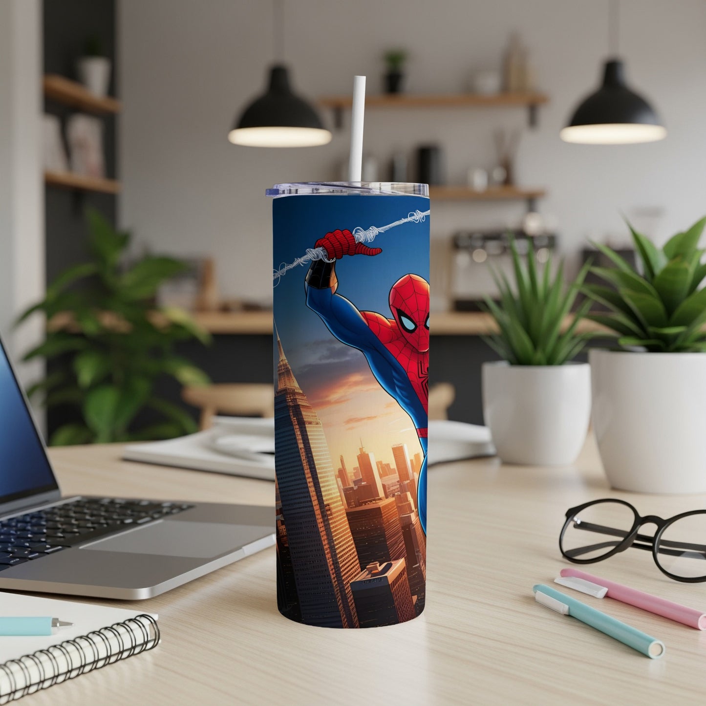Spider-Man swinging over a city skyline on a white insulated tumbler.