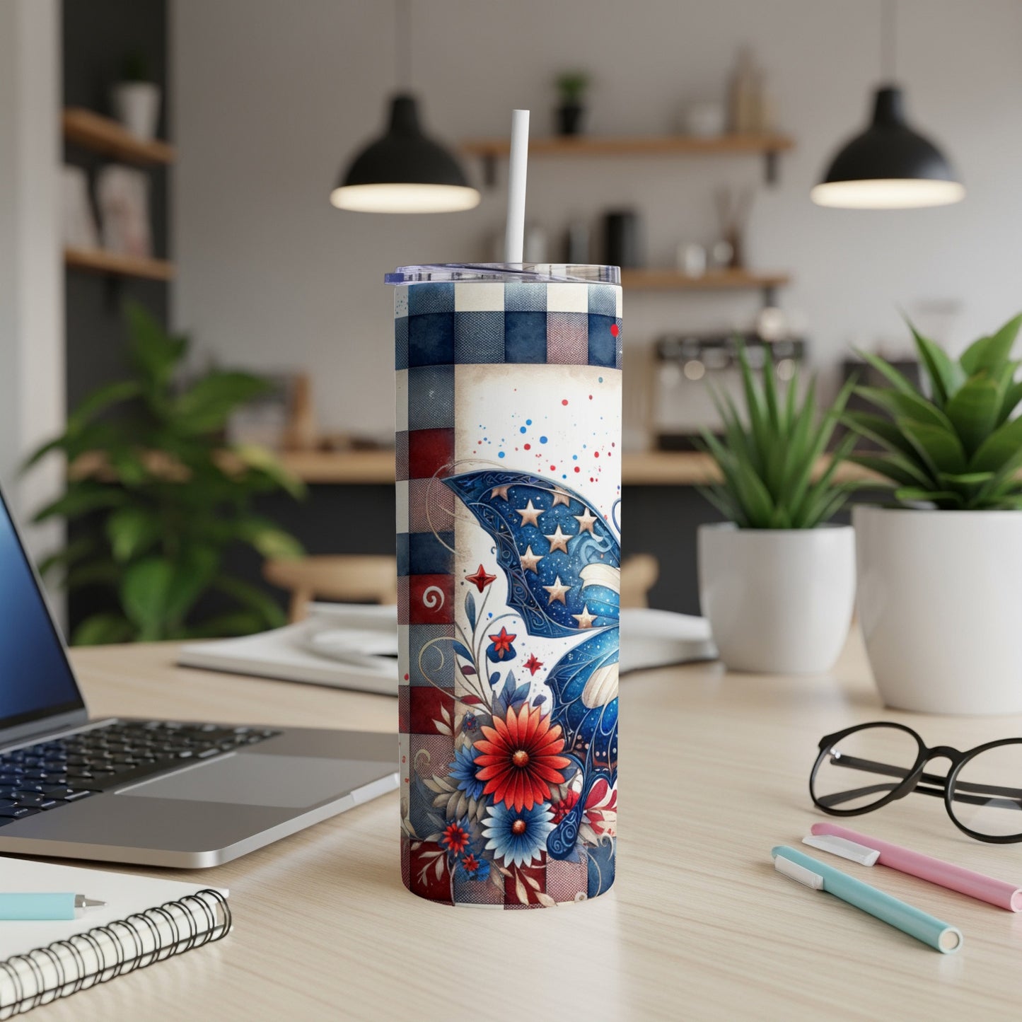 Blue, white, and red checkered tumbler with butterfly and floral design.