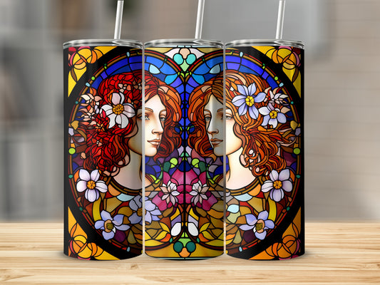 Two profile views of women's faces with floral stained glass border.