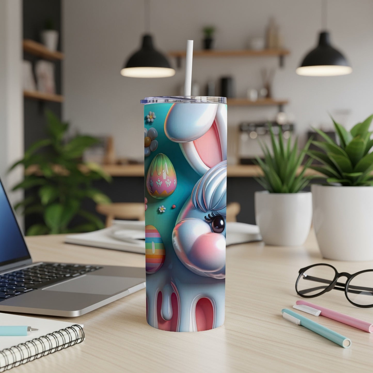 Easter bunny tumbler with colorful eggs and floral accents on a desk.