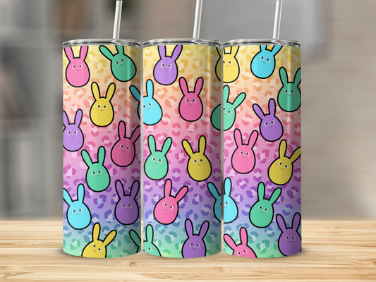 Three tumblers with a pastel bunny pattern on a leopard print background.