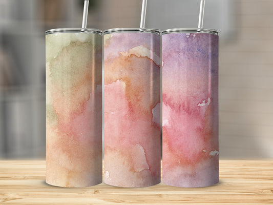 Three tumblers with watercolor designs in pinks, purples, and greens.