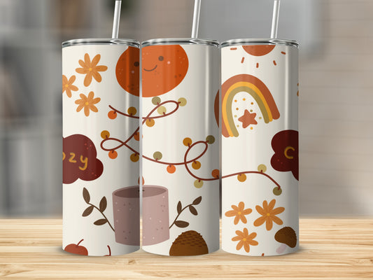 Three tumblers with fall-themed illustrations, including pumpkins, rainbows, and leaves.