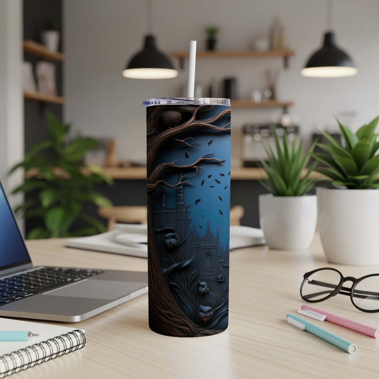 Tumbler with a dark, spooky scene featuring a castle and bats against a blue background.