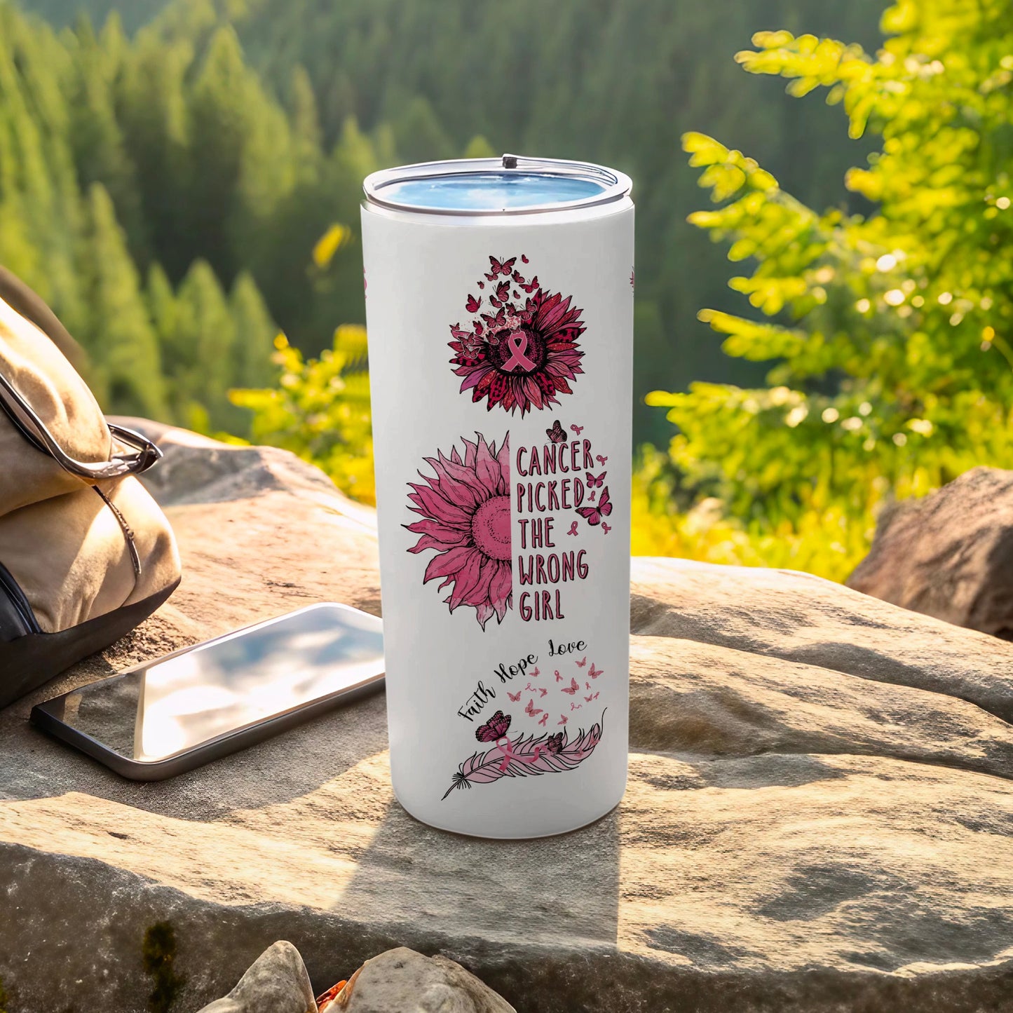 White tumbler with pink sunflower and cancer awareness ribbon design.