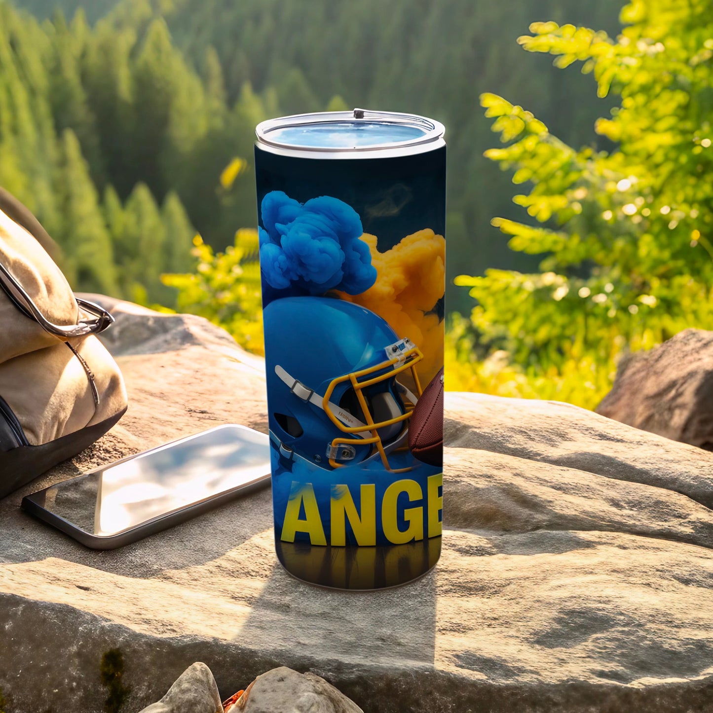 Blue and gold football helmet and ball on a tumbler with "ANGELES" text.