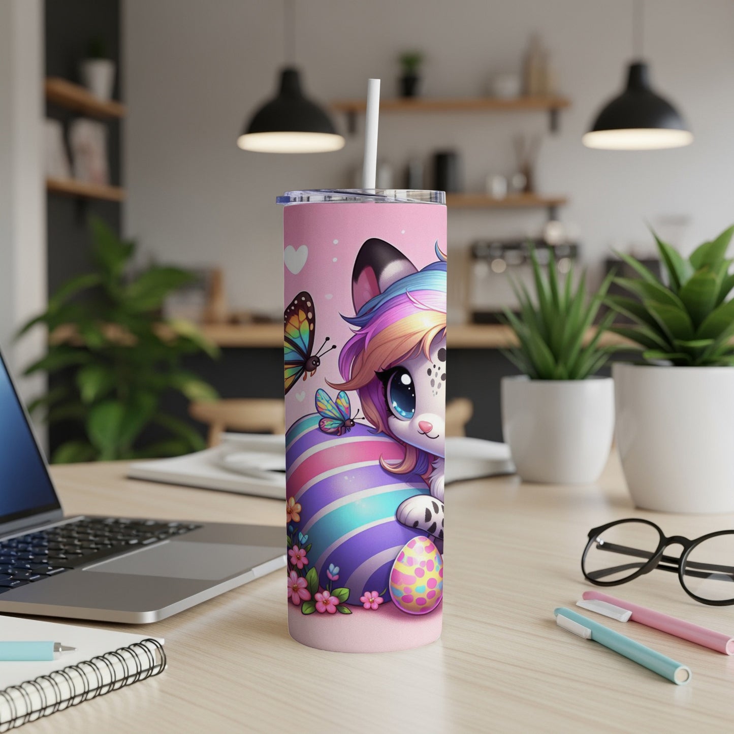 Pink tumbler with a cartoon cat wearing rainbow hair and butterfly wings, holding an Easter egg.