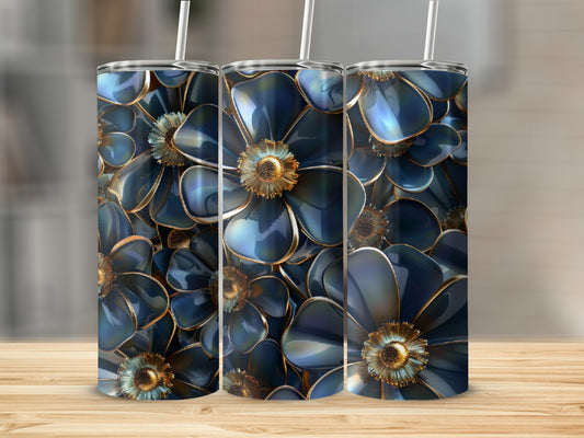 Three dark blue floral tumblers with golden centers on a wooden surface.