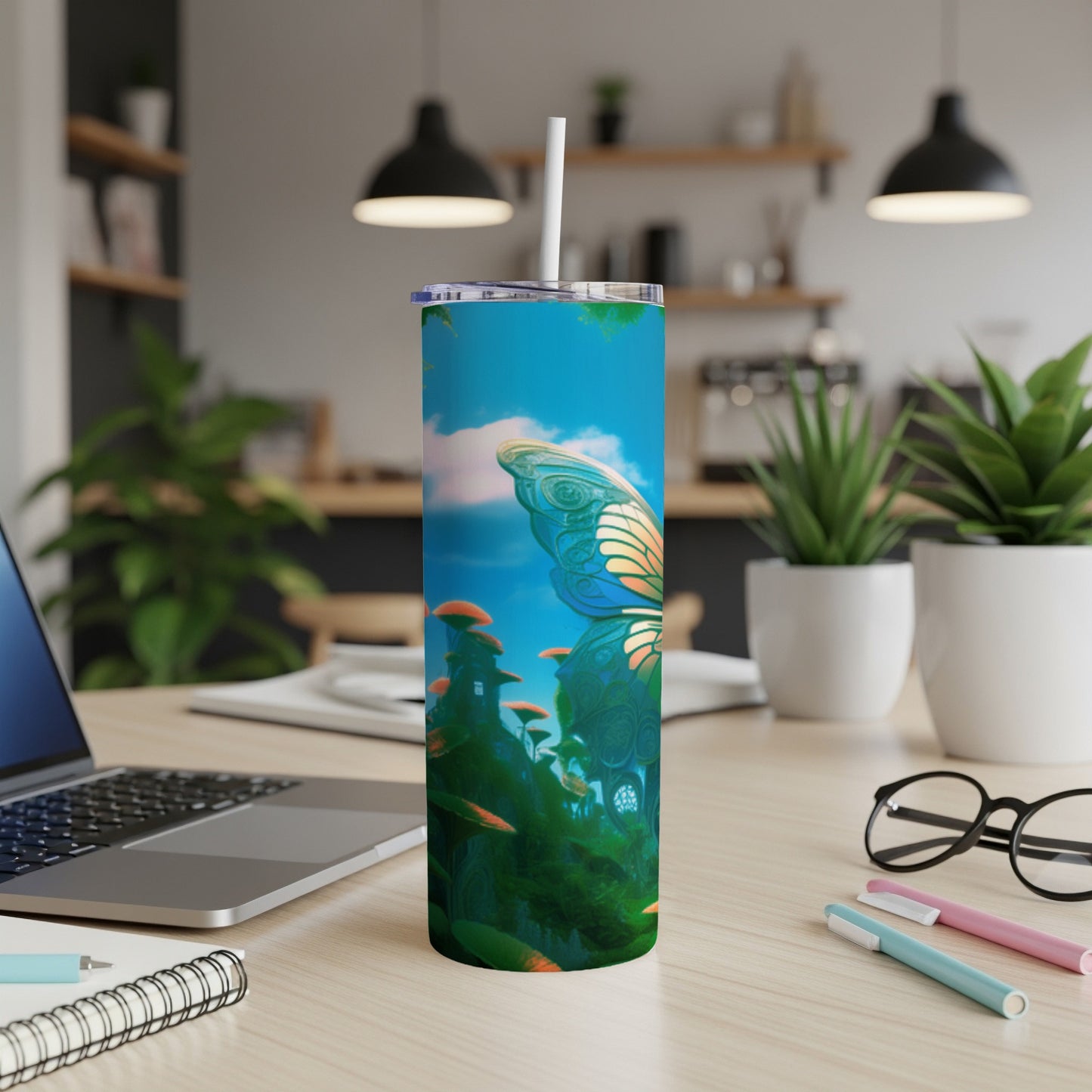 Tall tumbler with butterfly and fantasy landscape design.
