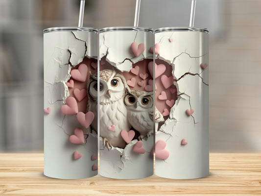 Two owls on a cracked white surface surrounded by pink hearts.