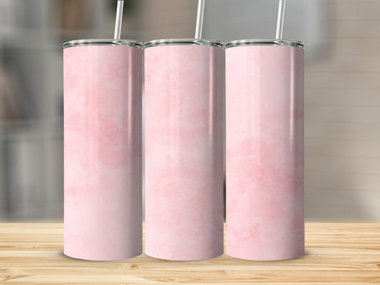 Three tall pink watercolor tumblers with straws on a wooden surface.