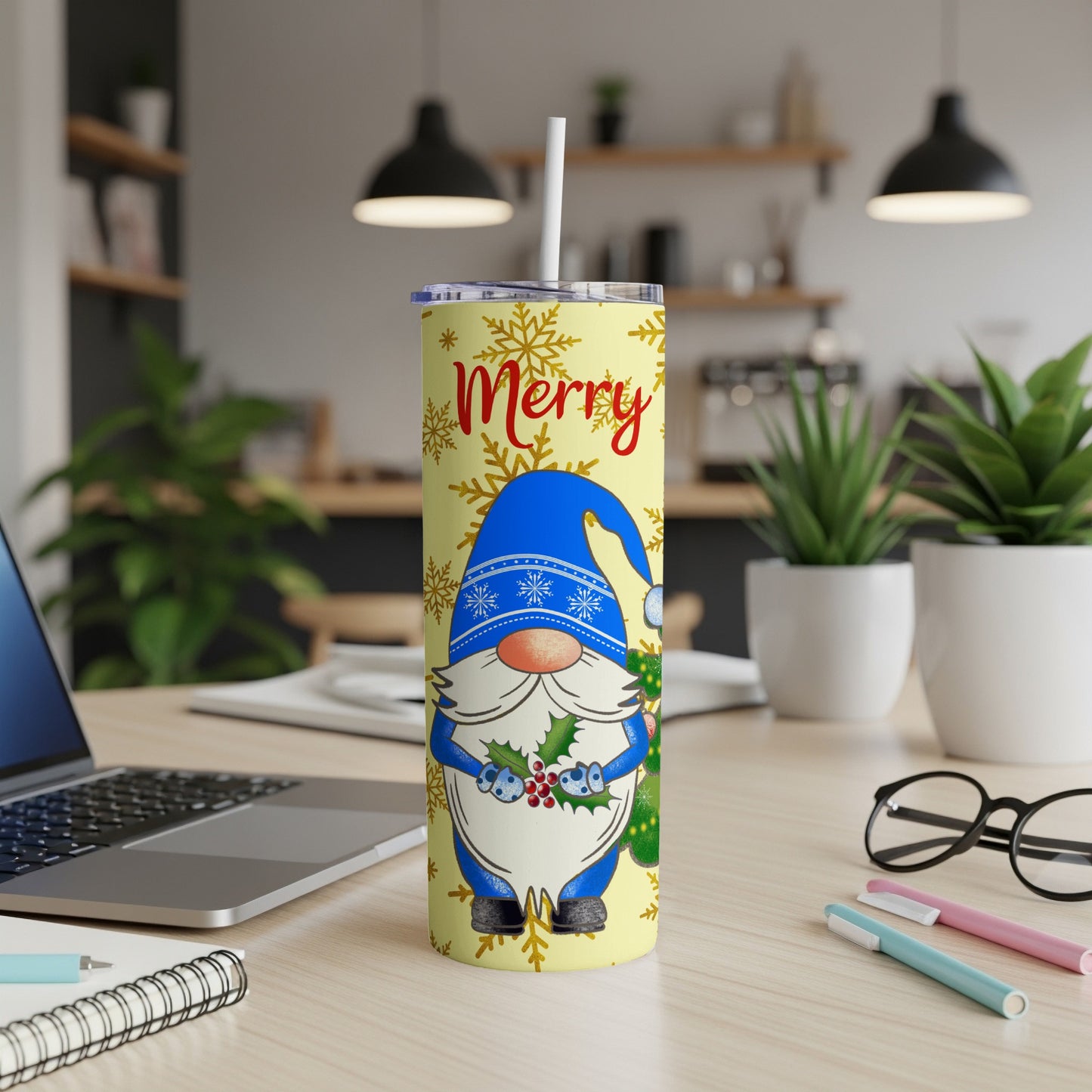 Blue gnome with snowflakes and "Merry" text on a yellow Christmas tumbler.