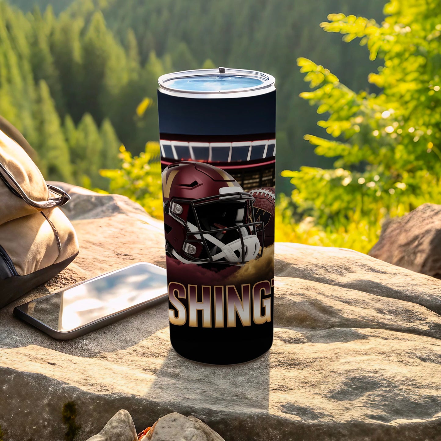 Washington football helmet and ball on tumbler with stadium background.