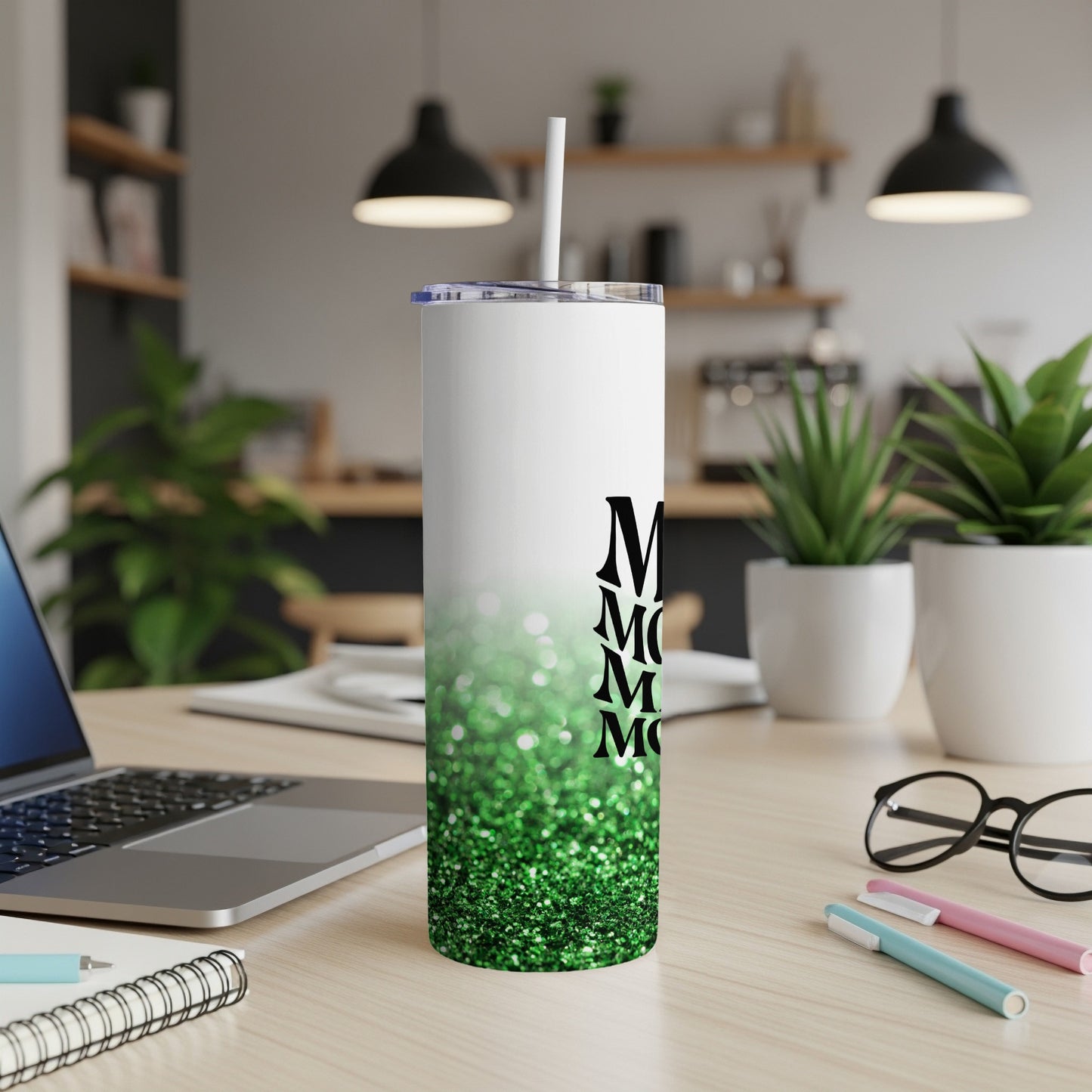 White tumbler with green glitter gradient and "Mom" text.