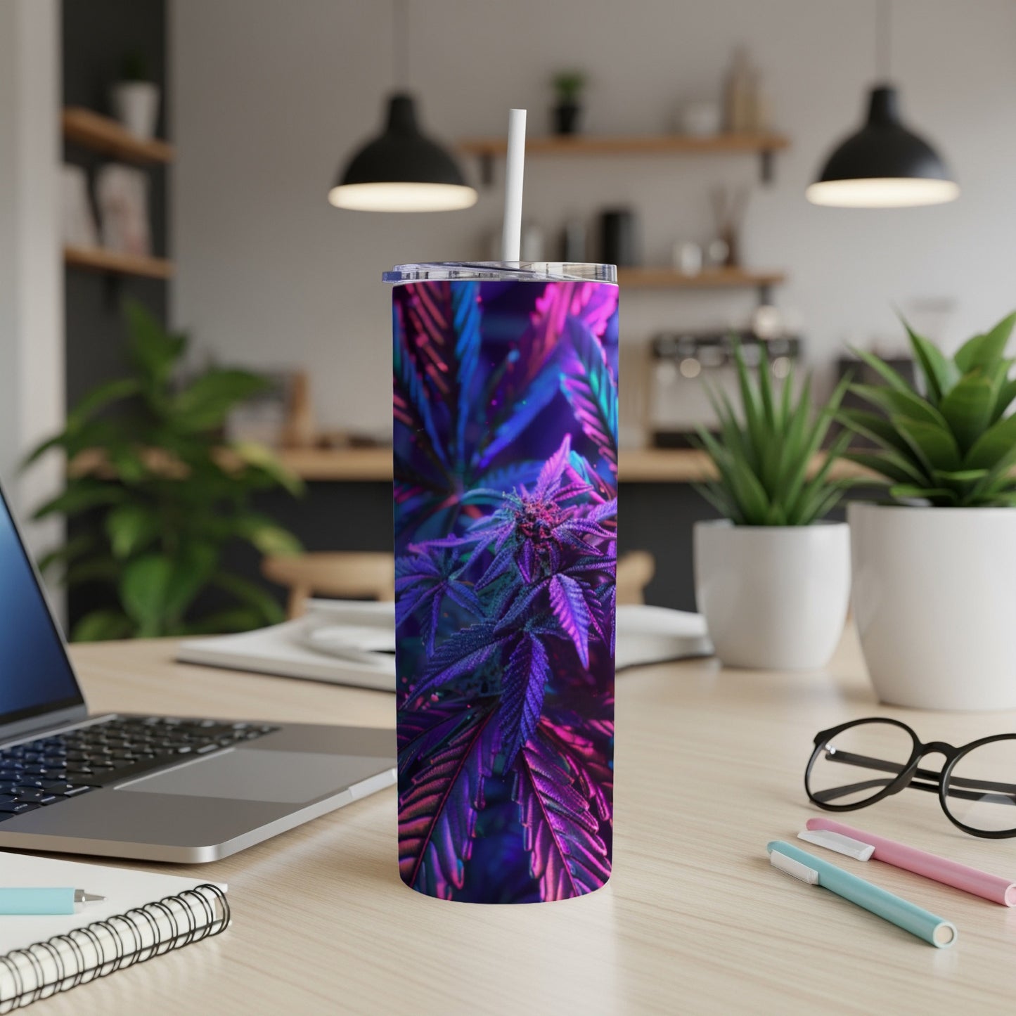 Purple cannabis bud and leaves on a modern tumbler with a straw.