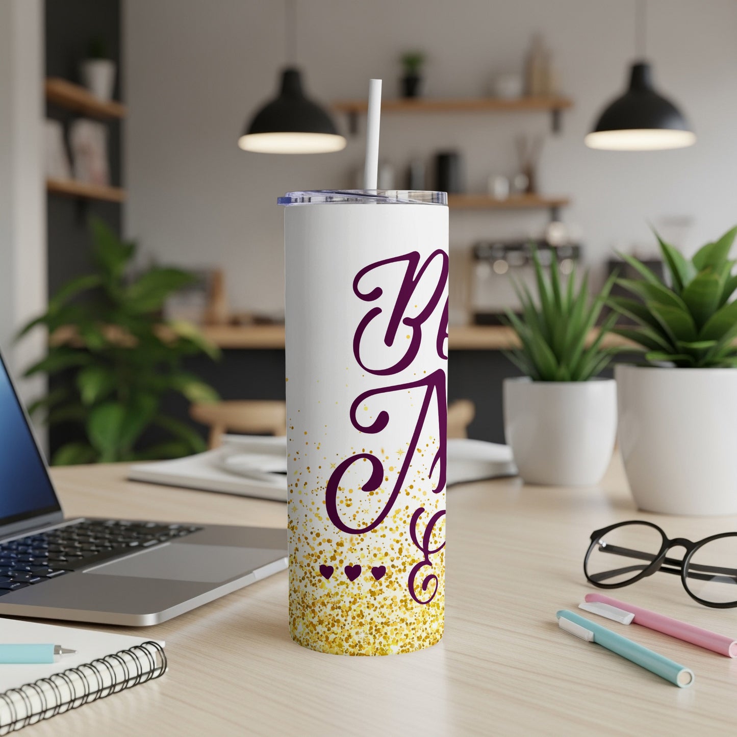 White tumbler with "Best Auntie" in purple script and gold glitter.