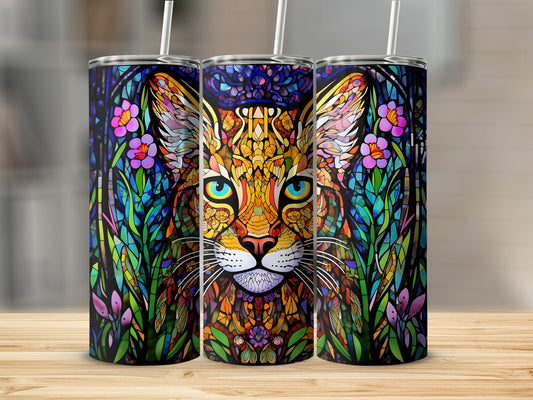 Stained glass cat tumbler with floral accents and straw.
